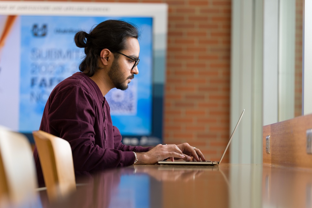 Student studying with a laptop